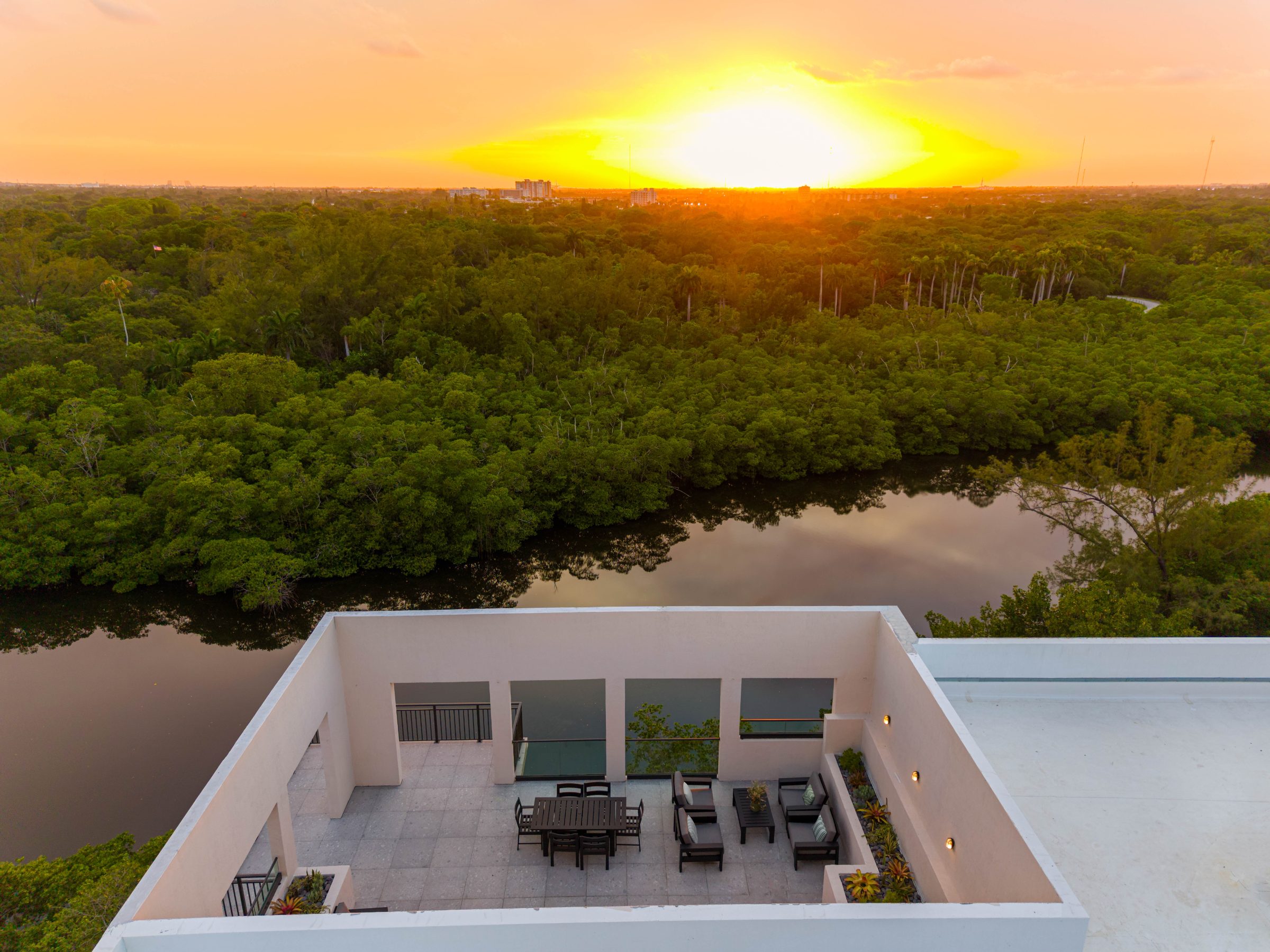 Golden-hour rooftop terrace overlooking the mangroves at Arvella, Aventura